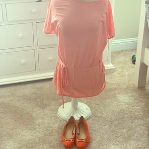 Orange, and white striped shirt. orange shoes.